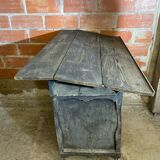 Antique writing desk, blackened wooden filing cabinet.