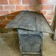 Antique writing desk, blackened wooden filing cabinet.