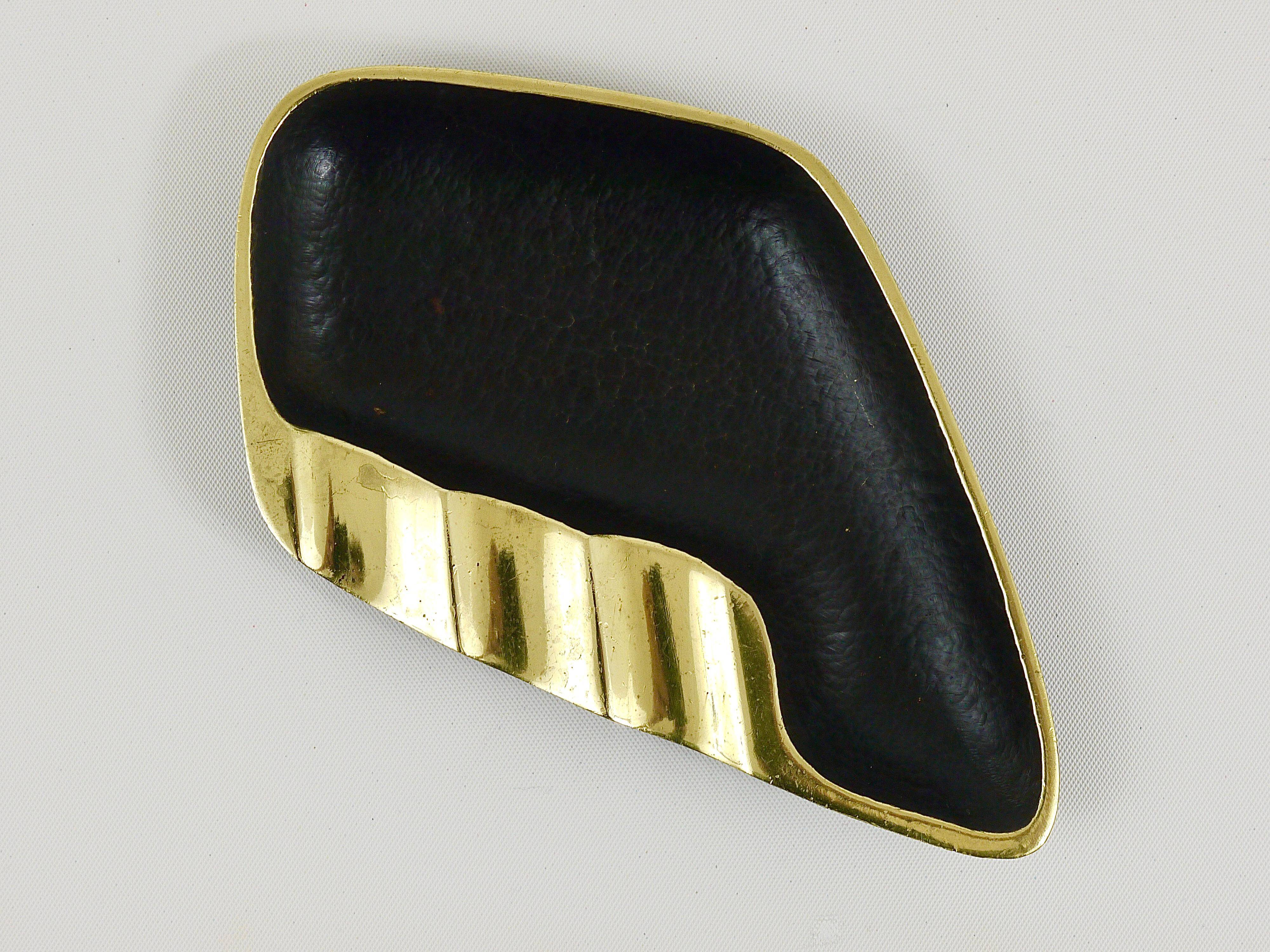 Asymmetrical modernist ashtray by Walter Bosse in black brass by Herta Baller, 1950s.
