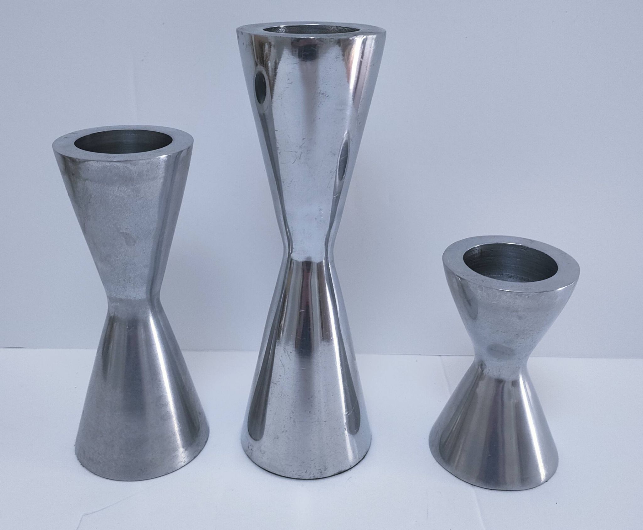 three "diabolo" aluminium design candle holders 90