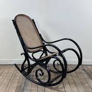 Rocking chair in blackened curved wood and cane, 1900s