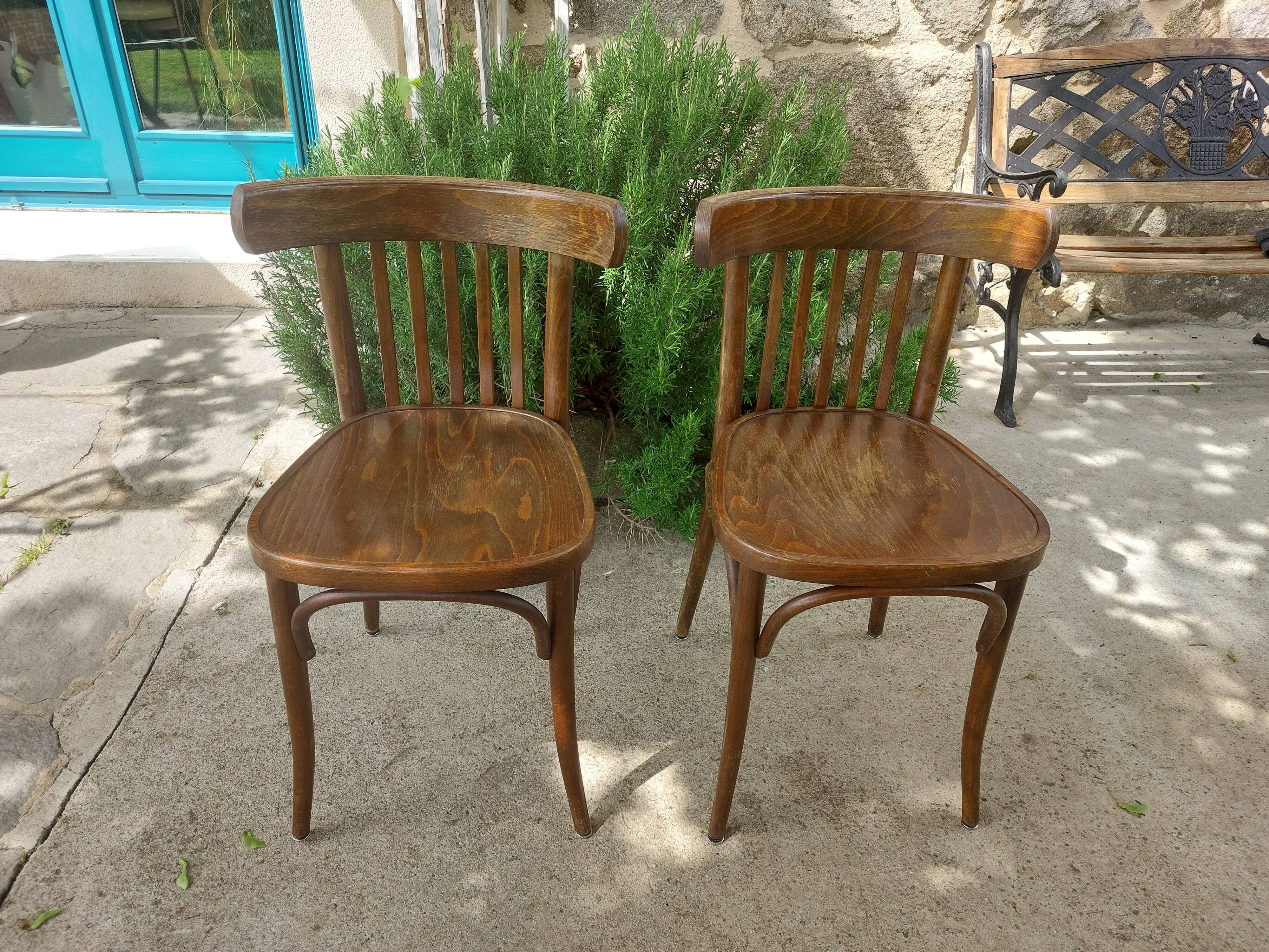 pair of dark bistro chairs, rounded backs, Baumann style