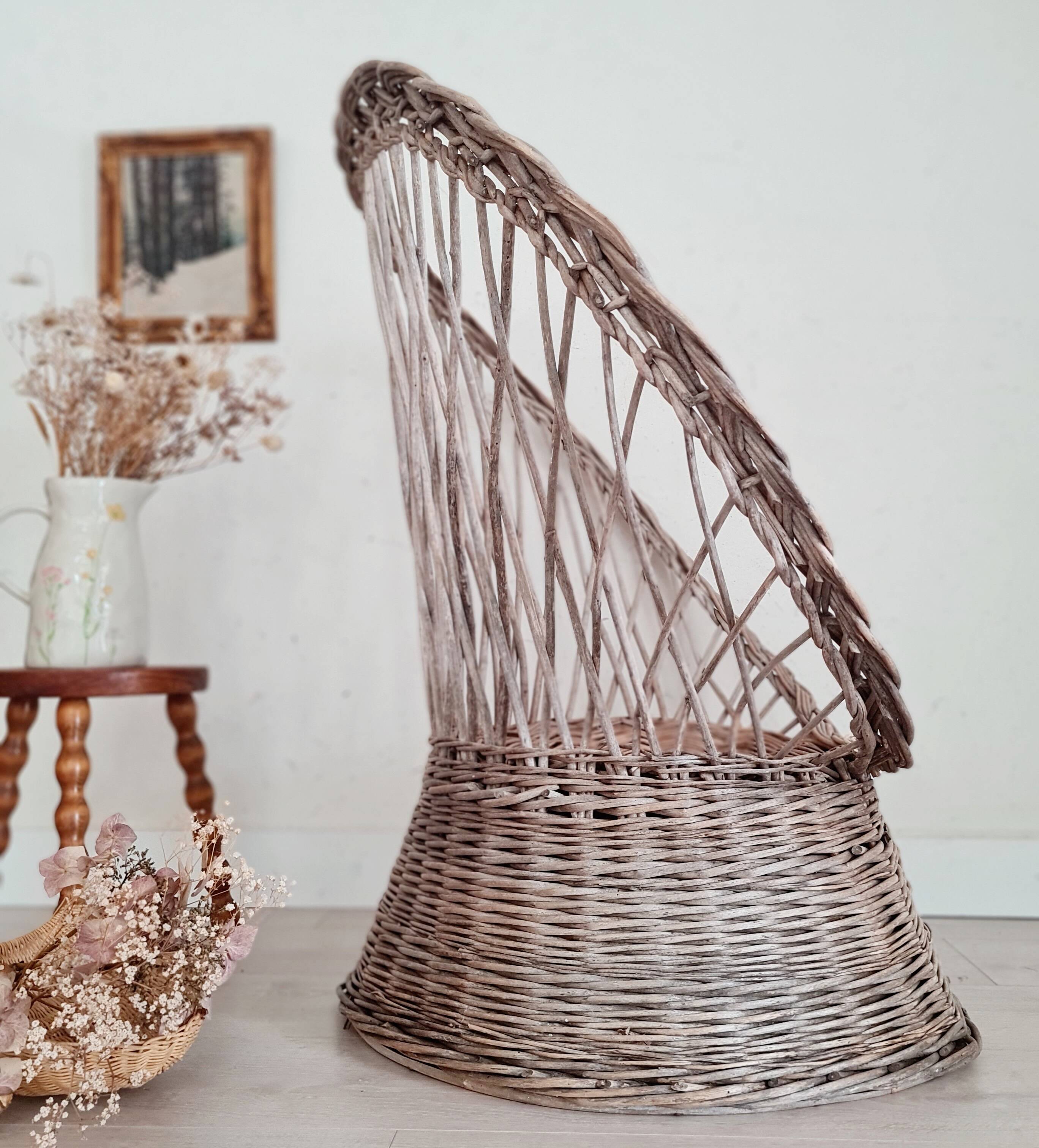 Antique armchair in gray woven wicker