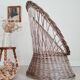 Antique armchair in gray woven wicker