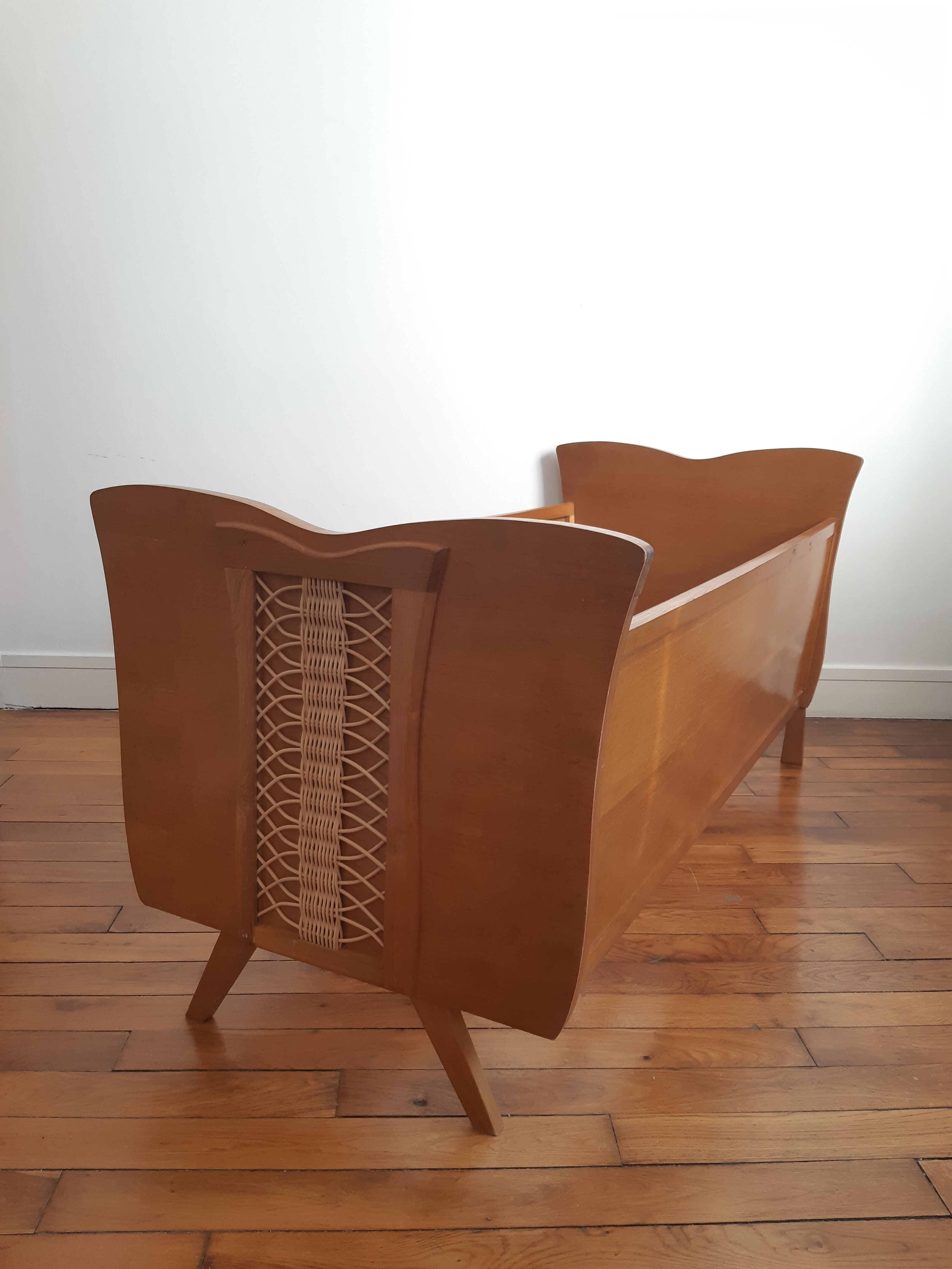 Wooden bed and vintage rattan