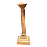 Bronze candle holder with floral motifs.