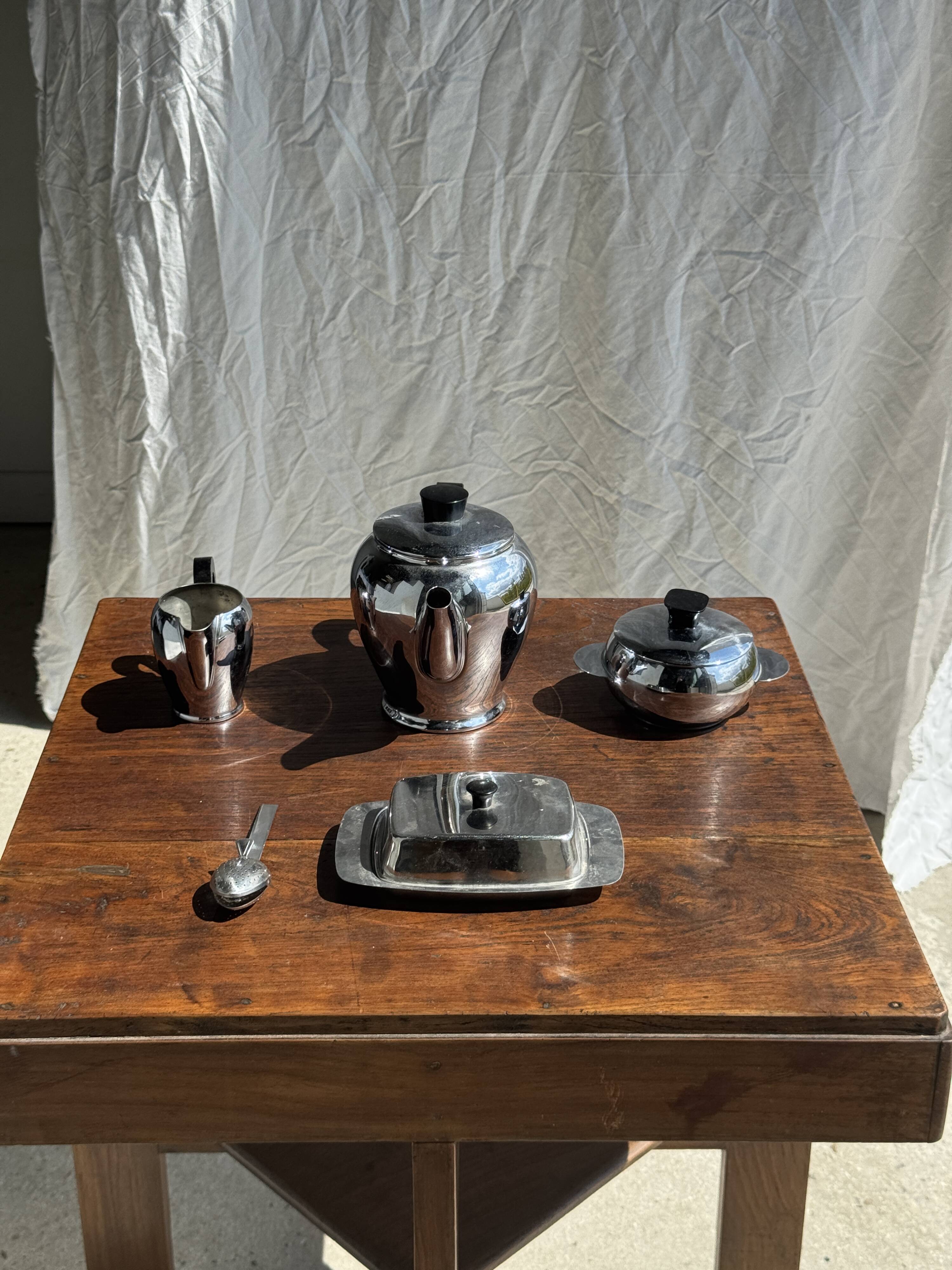 Tea set including teapot, milk jug, sugar bowl and butter dish