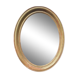 Golden oval mirror