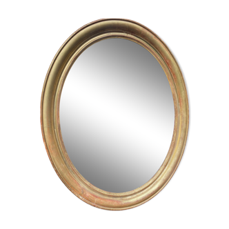 Golden oval mirror