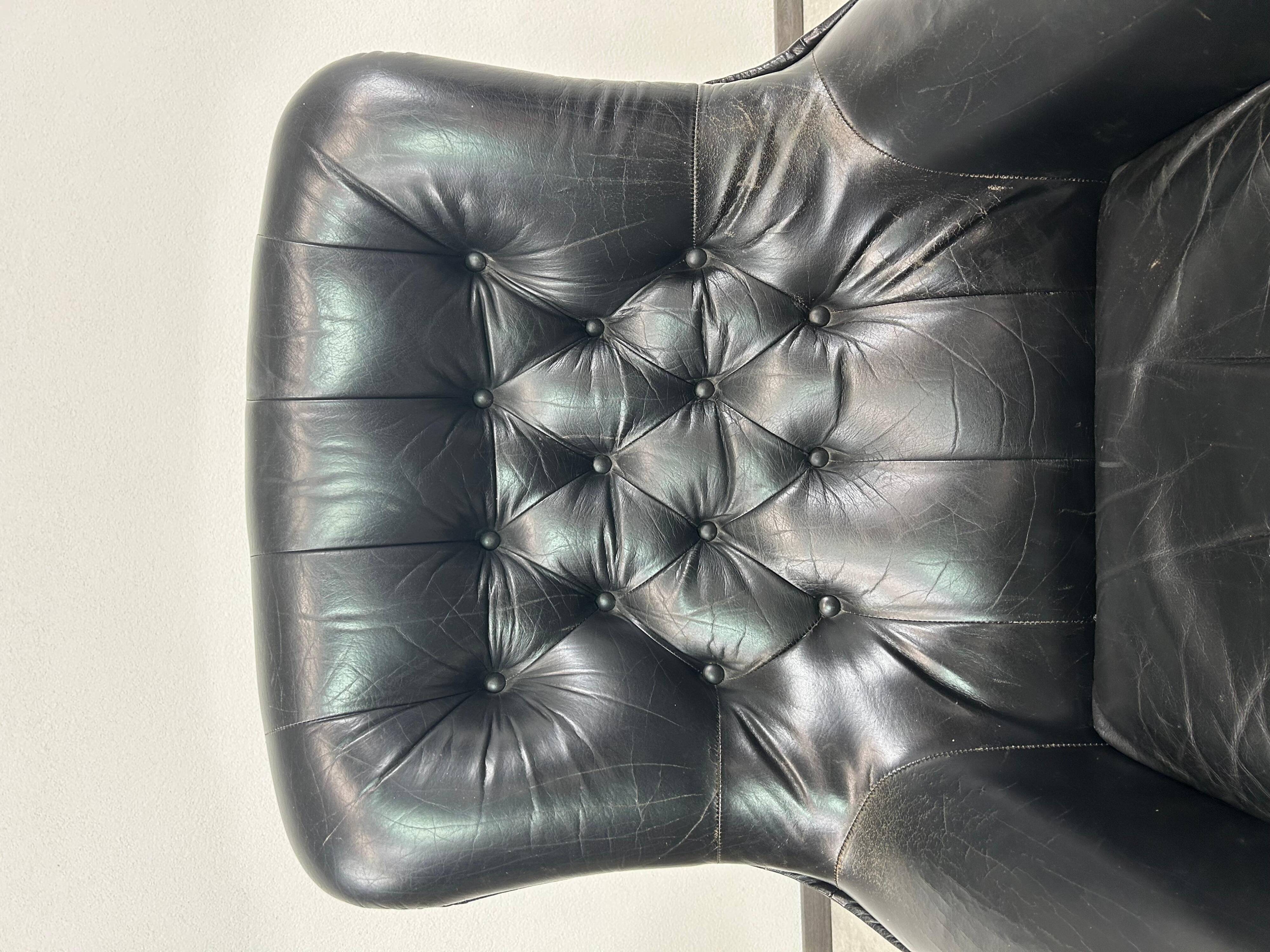 Black leather wingback swivel chair by PeeM