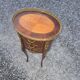 Oval bedside table in Louis XV style with marquetry.