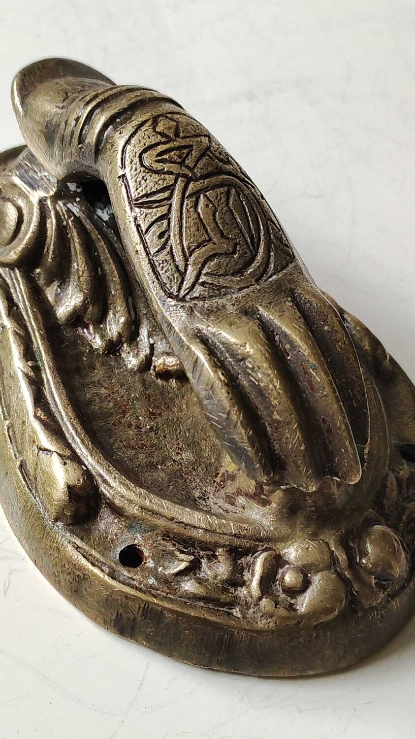 Door knocker in bronze