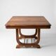 Art Deco extendable table in solid wood and brass.