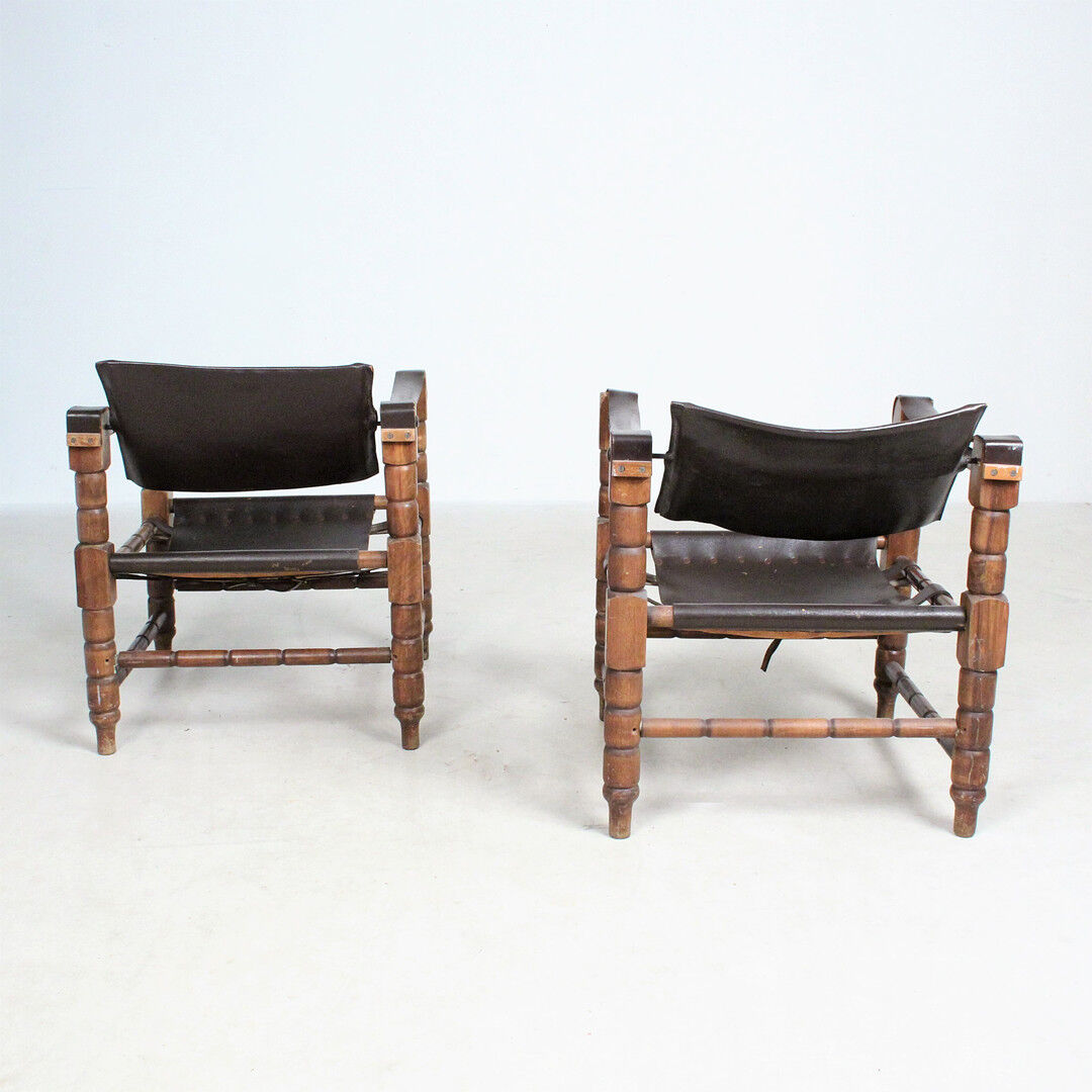 Pairs of vintage Safari style armchairs in wood and leather