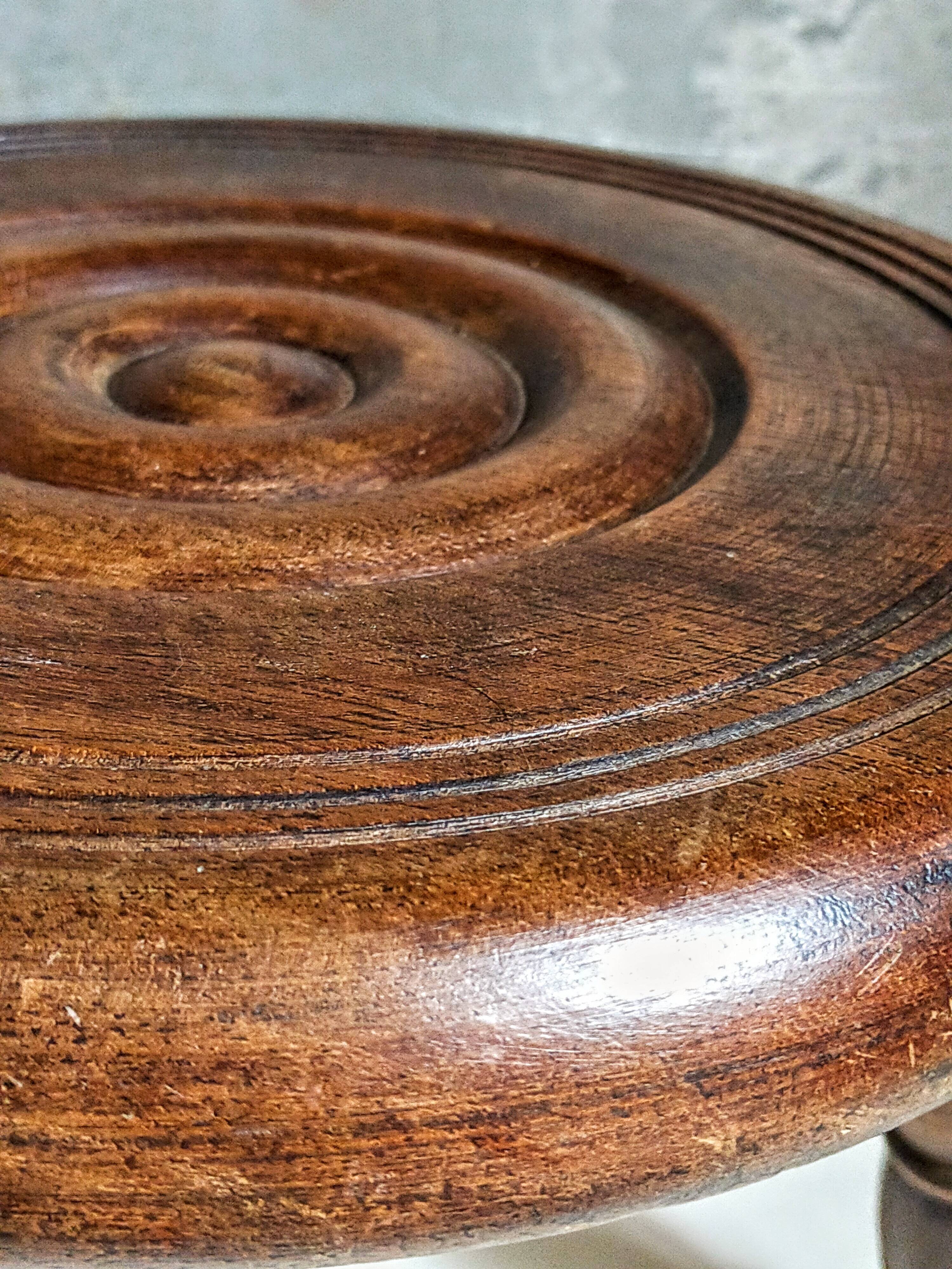 Low tripod stool in vintage turned solid wood