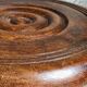 Low tripod stool in vintage turned solid wood