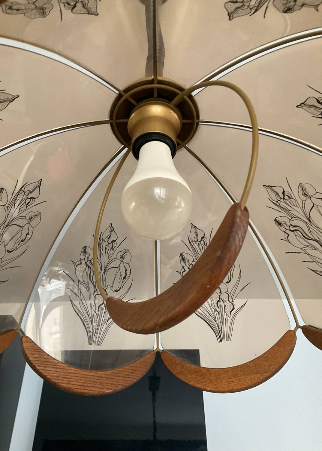 Scandinavian style glass and wood pendant light.