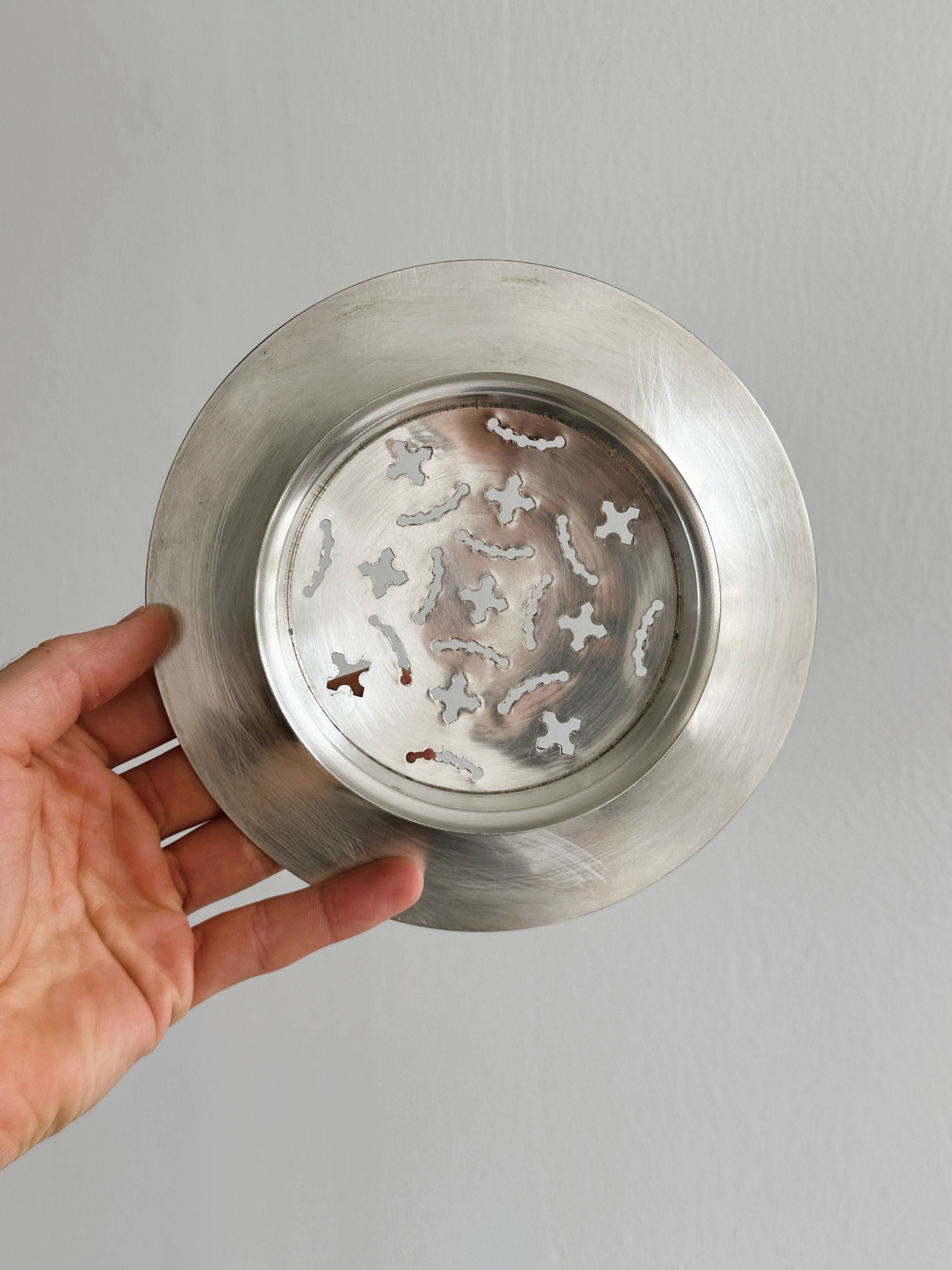 Antique butter dish in shiny metal