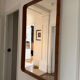 Jacques Adnet mirror covered in cognac leather