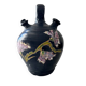 Black water jug with floral decoration