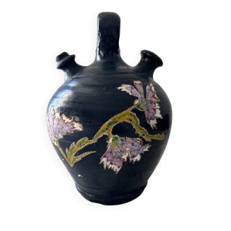 Black water jug with floral decoration