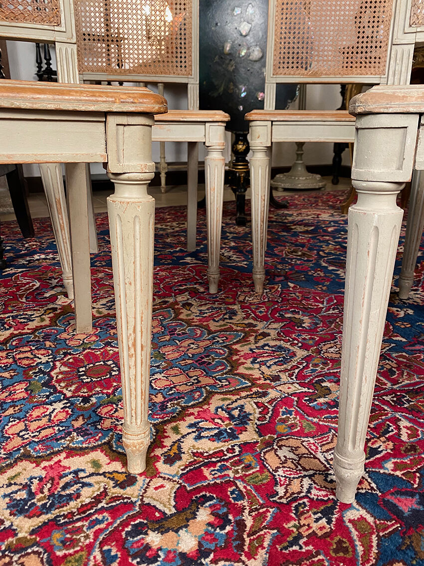 Set of four grey lacquered wooden chairs in the Louis XVI style, late 19th century.