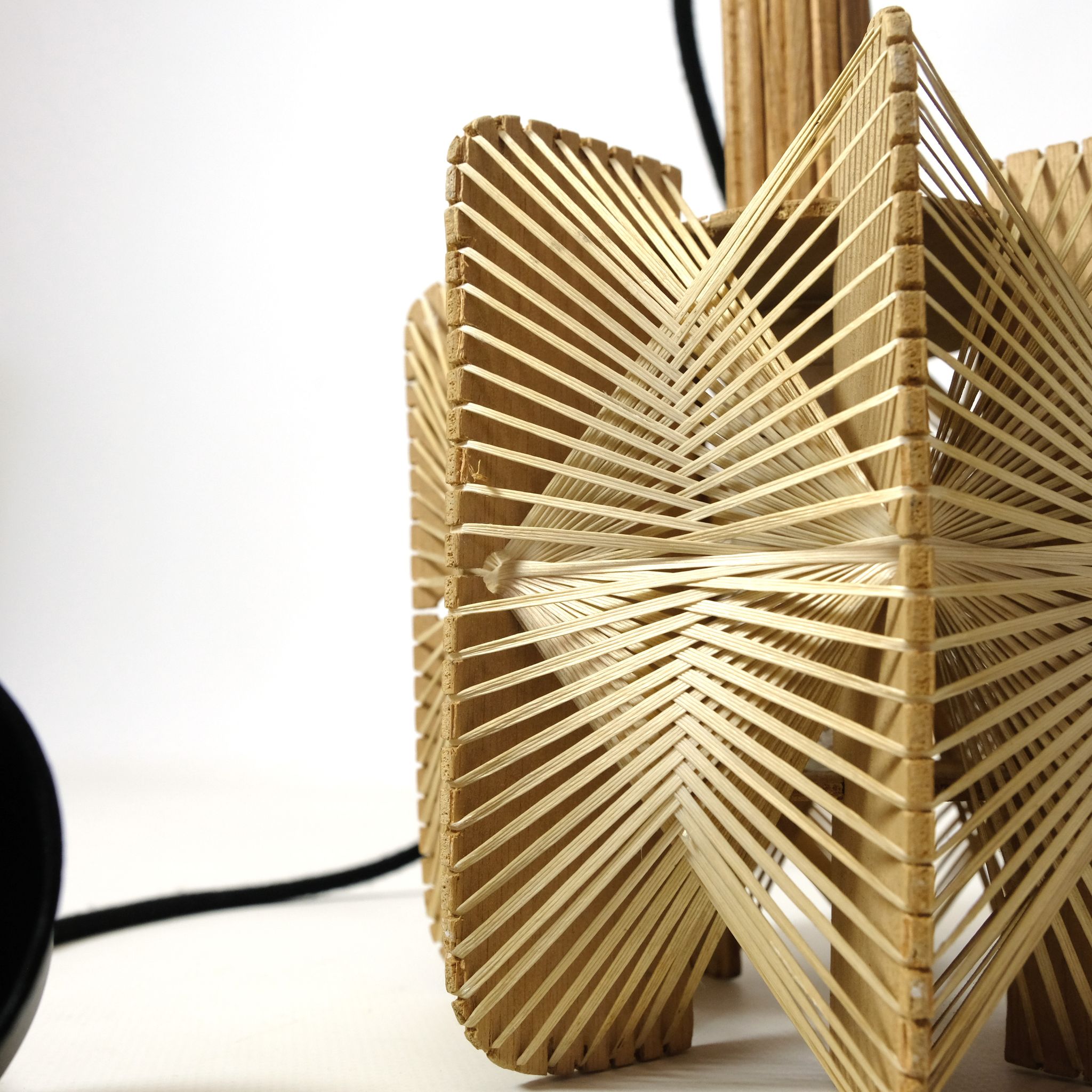 Hanging lamp in wood and threads of the 70