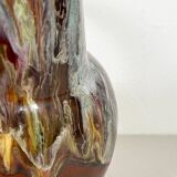 Large bird jug with high neck and handle, signed under the base