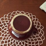 Old dark red ceramic pitcher jug