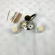 Vintage salt and pepper shakers and their chrome metal support