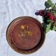 Small antique lacquered dish with hand-painted floral decoration.