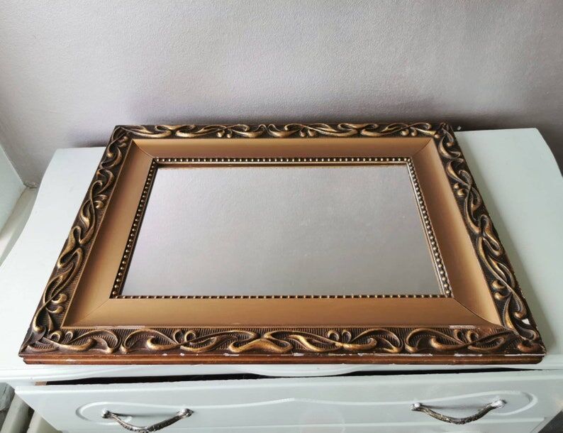 Beautiful French vintage mirror in gilded wood from the 60s