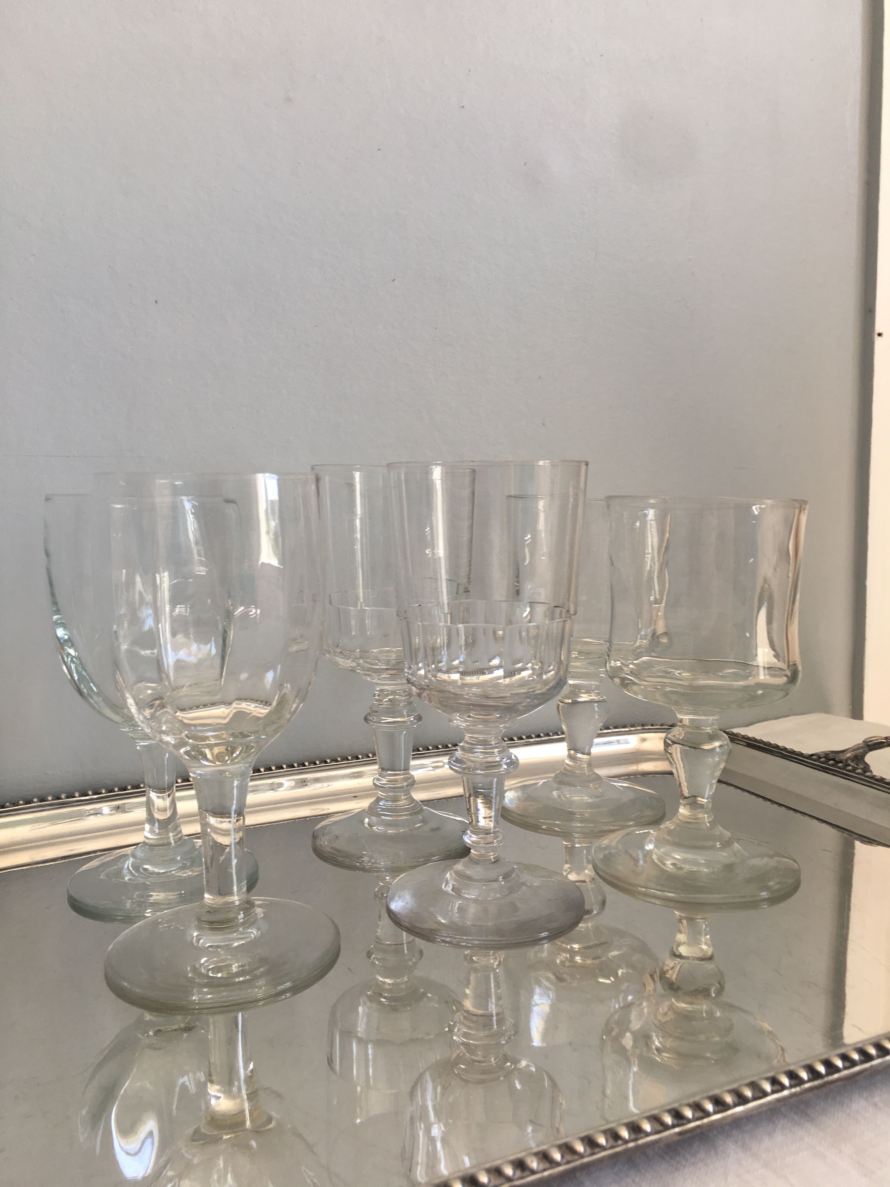 6 old mismatched water glasses
