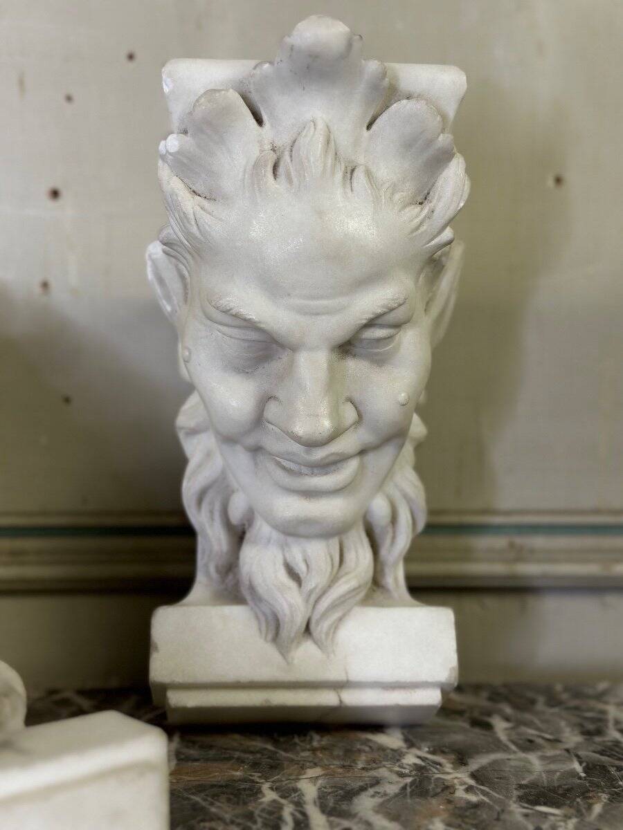 Pair of white statuary marble consoles, with faun heads