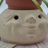 Cache pot visage