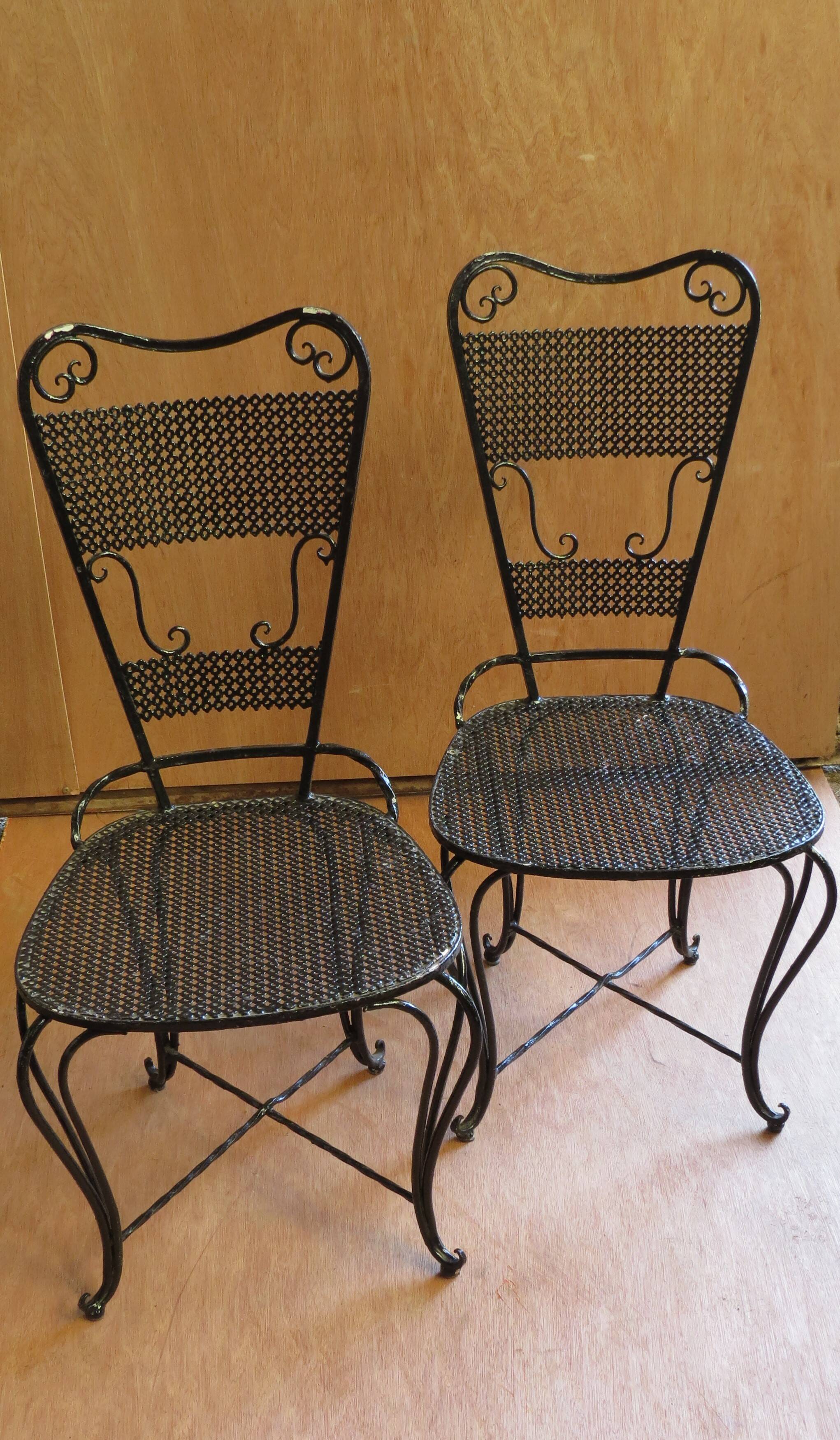 Pair of black lacquered wrought iron garden chairs