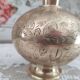 Chiseled brass pitcher decorated foliage