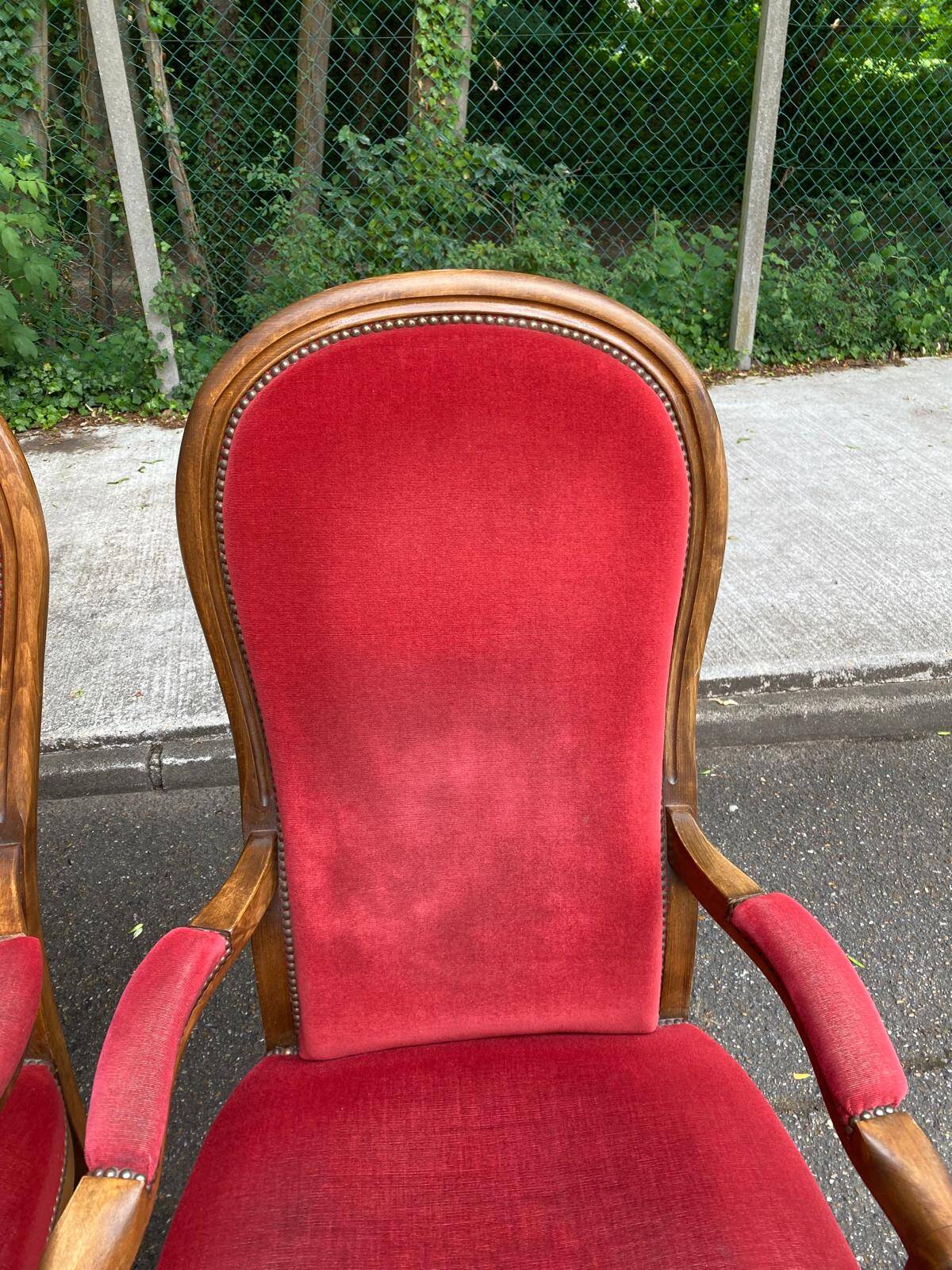 2 Louis Philippe cabriolet armchairs in burgundy velvet wood from the 19th century.