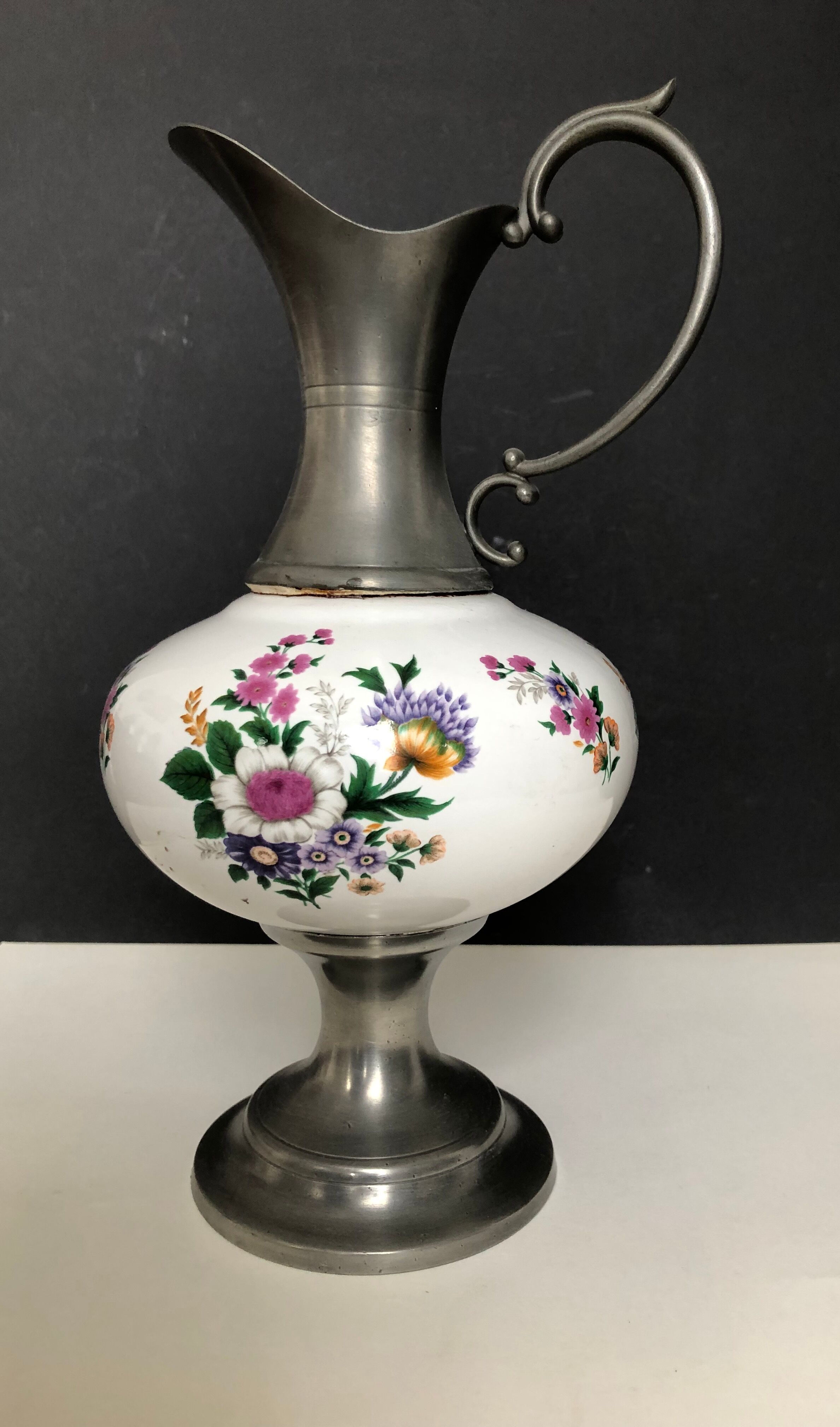 Ceramic and tin pitcher