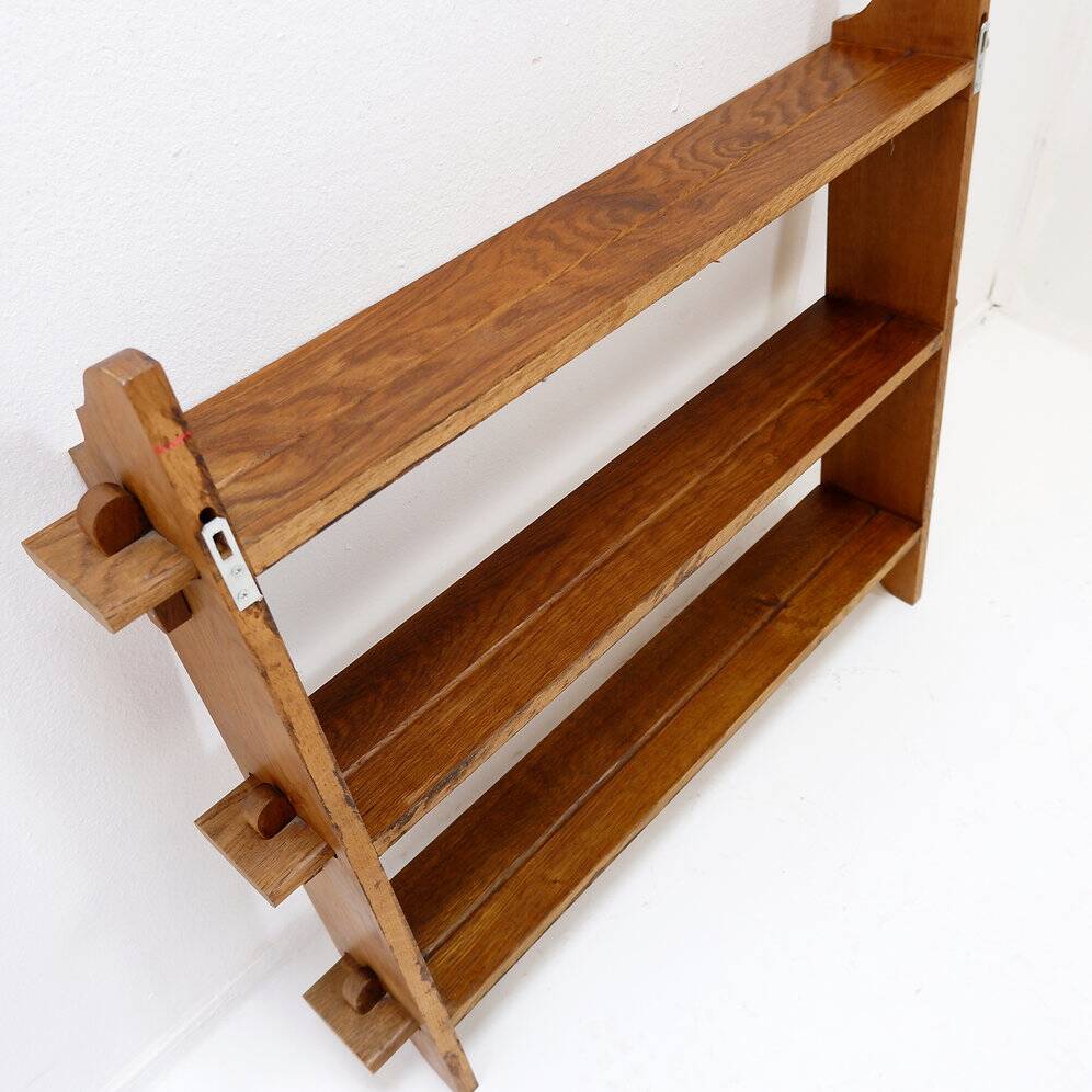 Wall shelves with dowels in Arts & Crafts style
