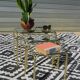 Nested table in gold metal and glass