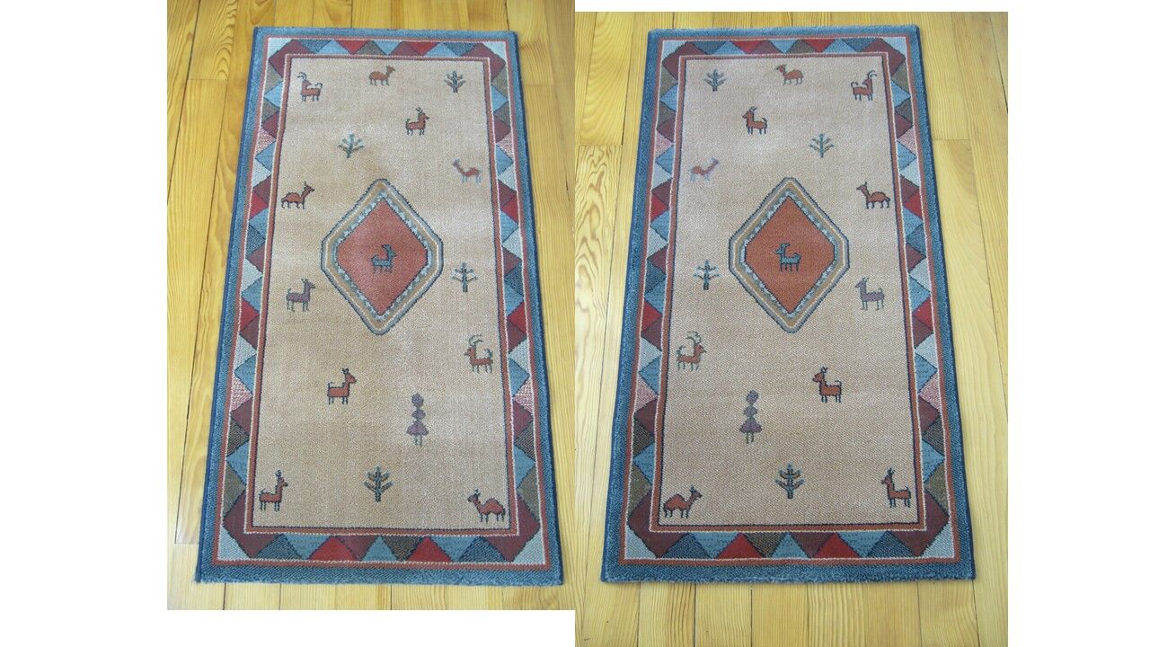 Pair of 60 x 120 Peruvian wool rugs
