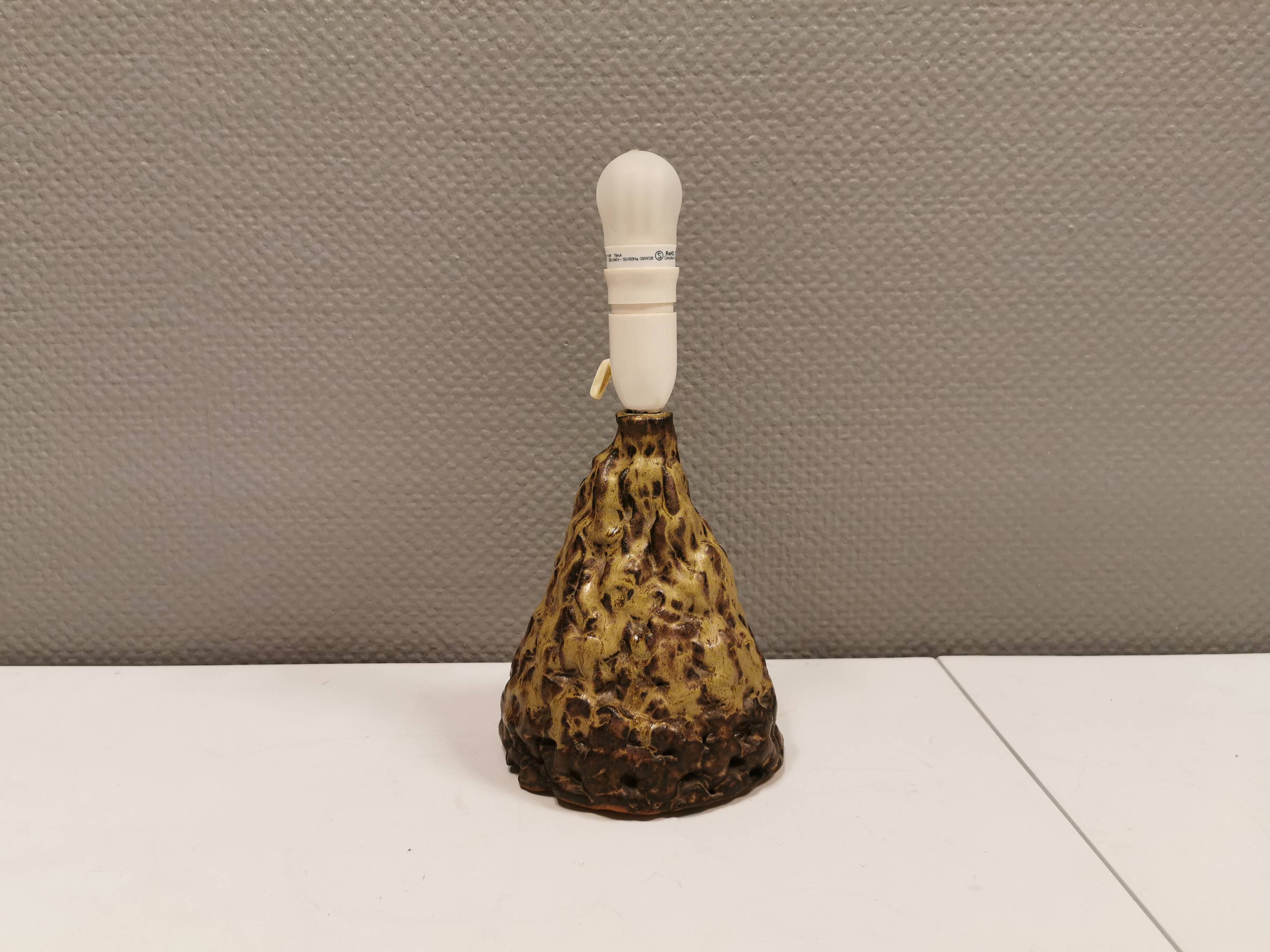 Ceramic table lamp, in greenish/brownish glaze, almost in the shape of a volcano.