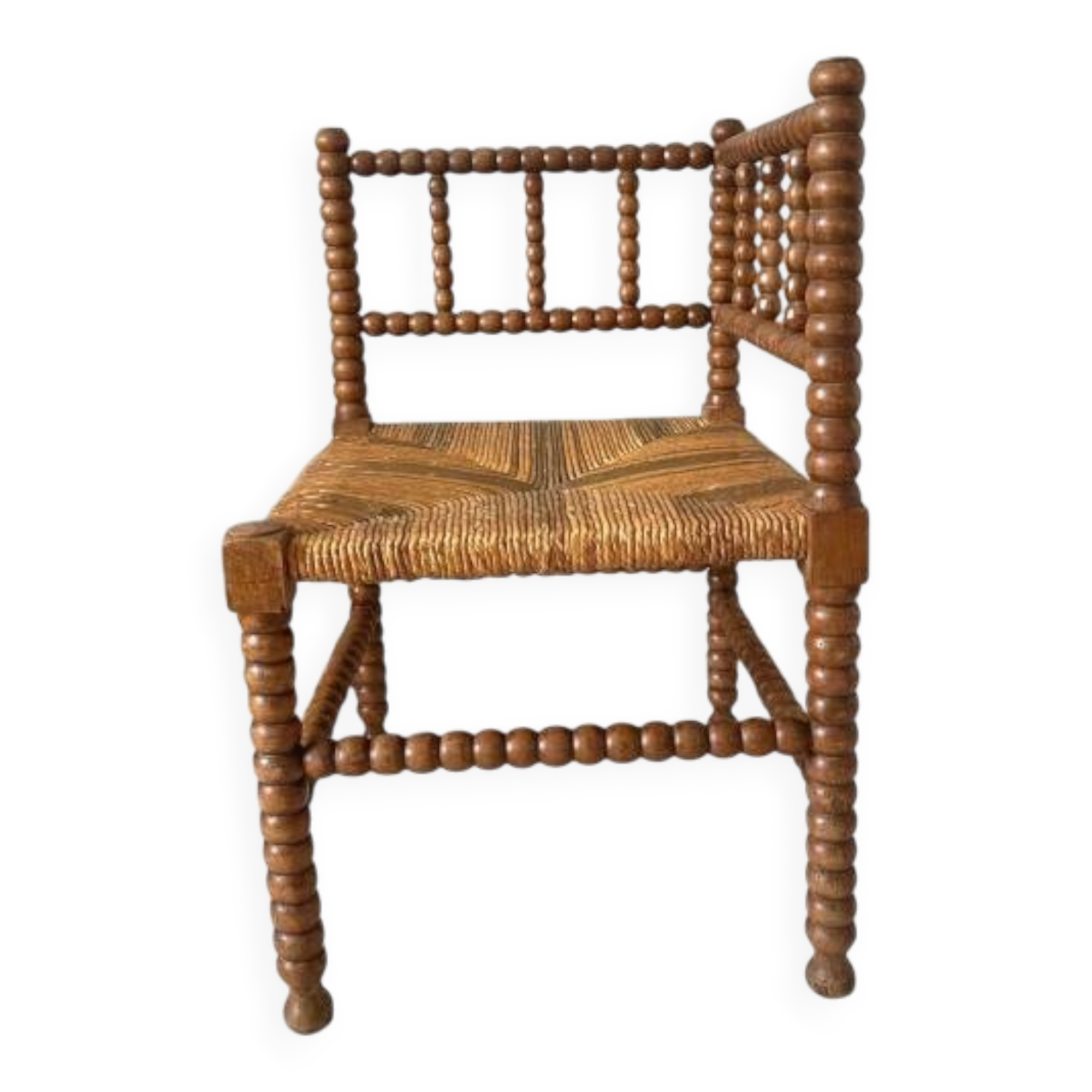 Corner chair in straw and turned wood, fireside chair.