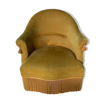 Velvet armchair with fringes
