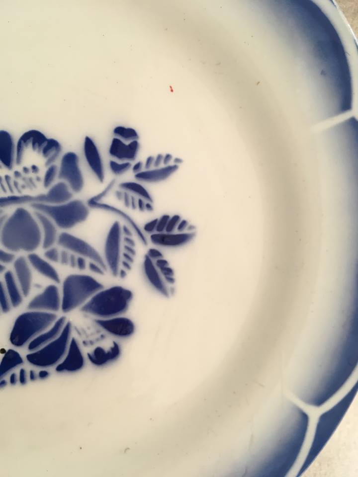 Together seven dessert plates mismatched in blue.