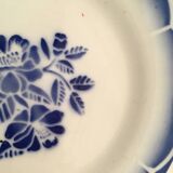 Together seven dessert plates mismatched in blue.
