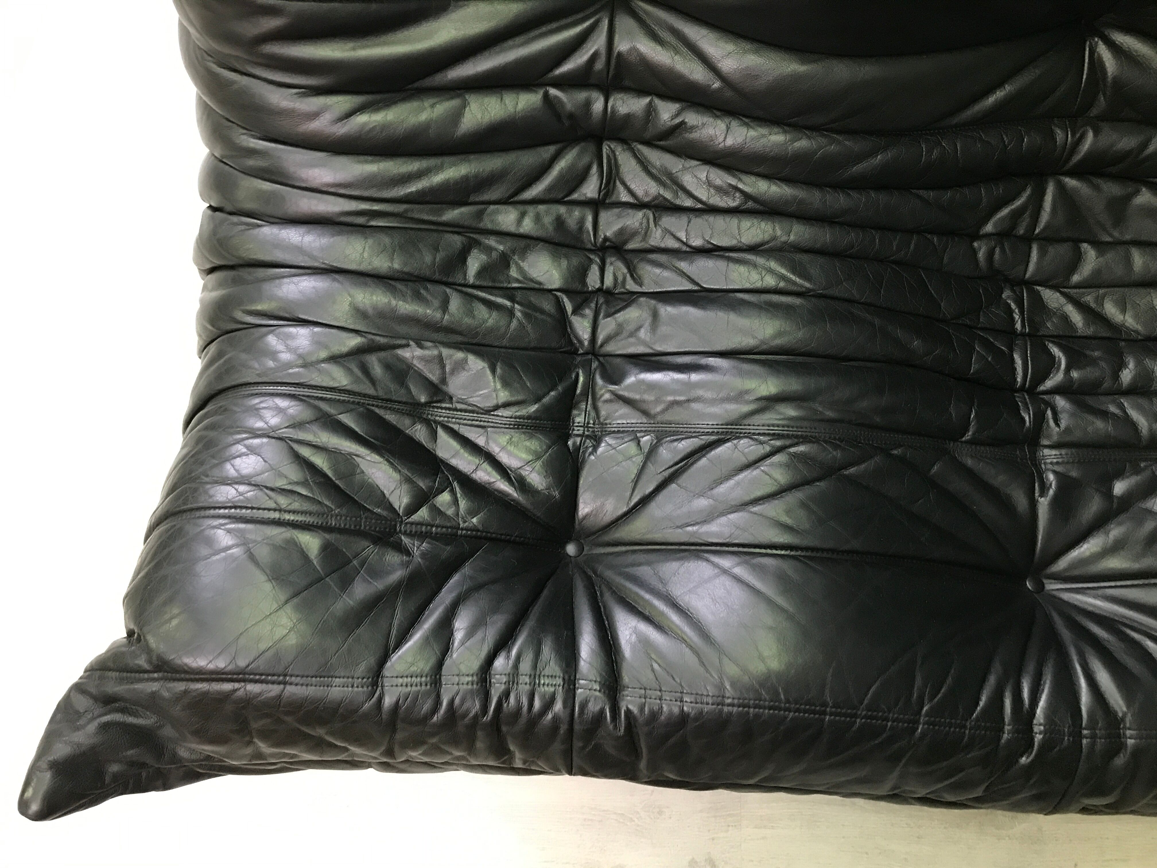 Black leather three seater sofa Togo by Ligne Roset