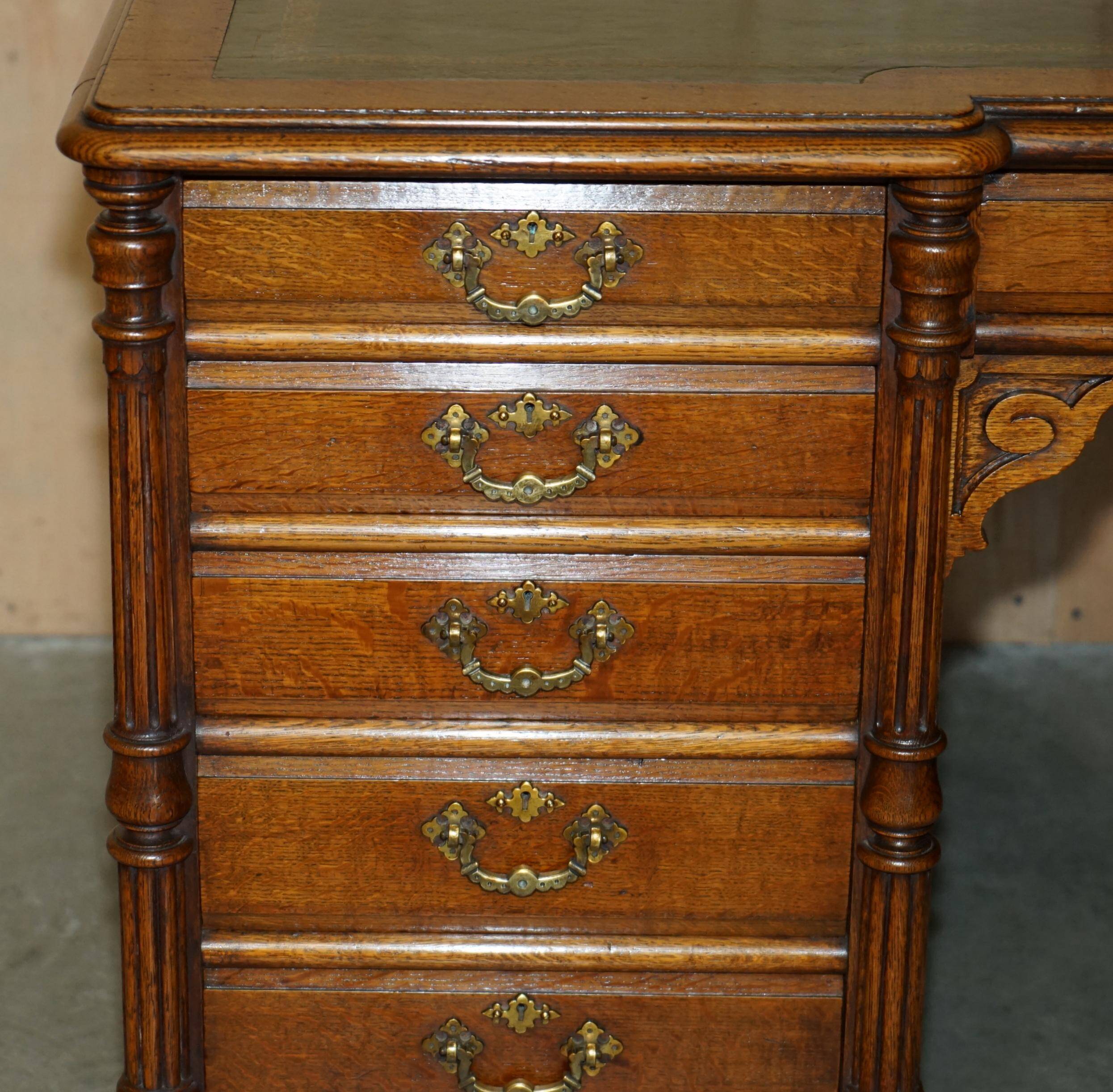 Antique double-sided desk C Hindley & Son in oak and leather