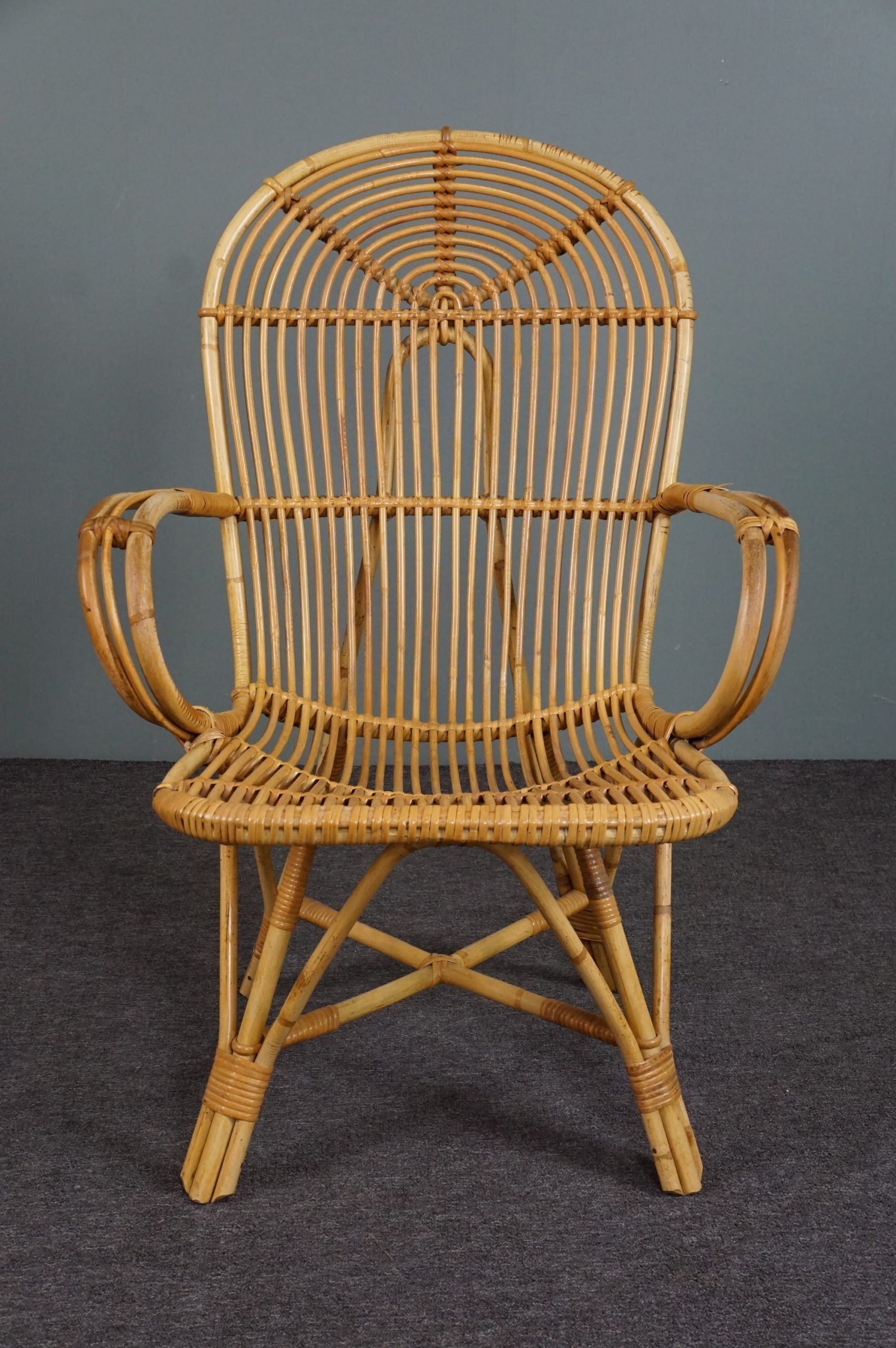 Rattan armchair with armrests by Rohé Noordwolde